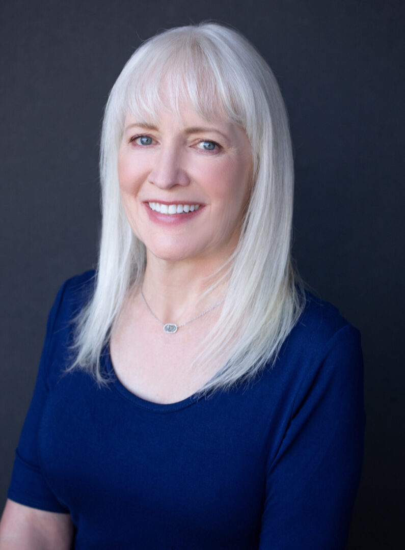 a portrait of woman with white hair